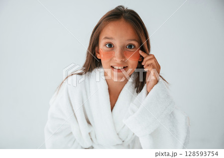 Positive look. With eye patches. Conception of beauty and self care. Young girl is in the studio 128593754