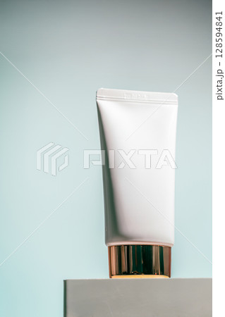 Cream jar with gold lid Cream jar with gold lid 128594841