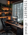 Cozy Winter Workspace Featuring a Wooden Desk, Plants, and a Scenic Computer Display 128596321