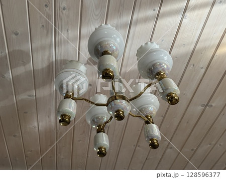 ceiling chandelier with flower-shaped ceiling lights. High quality photo 128596377