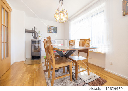 Modern dining room with elegant furniture, ideal for real estate and interior design 128596704