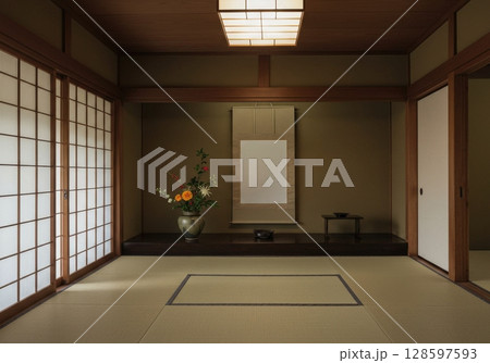 A serene traditional japanese room with tatami mats, a tokonoma alcove and ikebana flowers 128597593