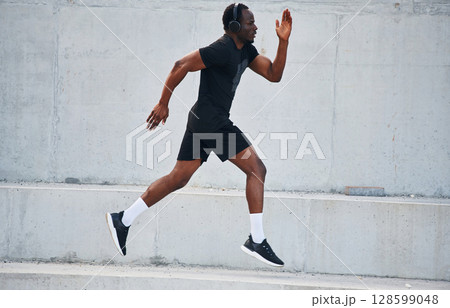 Active lifestyle. Sportive black man is running, morning routine Active lifestyle. Sportive black man is running, morning routine 128599048