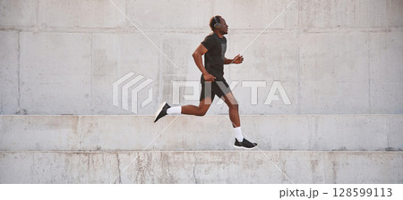 Side view. Sportive black man is running, morning routine 128599113