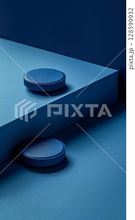 Two Blue Cylinder Podiums Against Geometric Wall On Blue Background With Shadow. Minimalism Style. 128599932