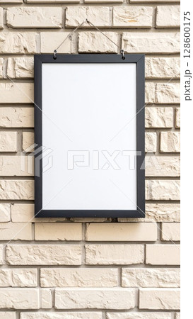 Blank White Frame on Beige Brick Wall 128600175