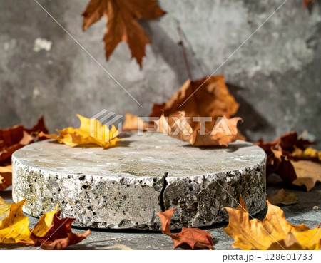Gray Stone Autumn Display with Colorful Leaves 128601733