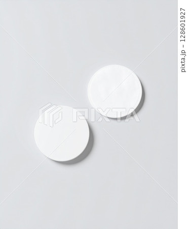 Two White Blank Circles on a Light Grey Background 128601927