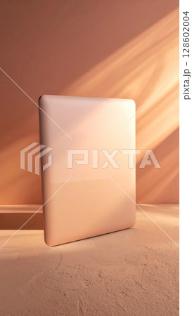 Beige Tablet on Peach Surface with Sunlight 128602004