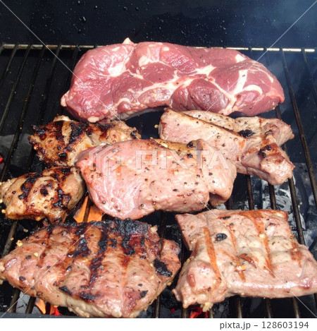 Juicy barbecue meat on the grill, close view, summer barbecue bliss background 128603194
