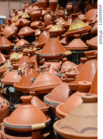A set of tagines of many types displayed in street stalls in the souk for sale. 128604944