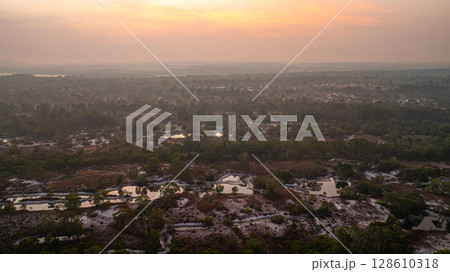 Aerial view of Scenic Sunrise Over Misty Savanna Landscape 128610318