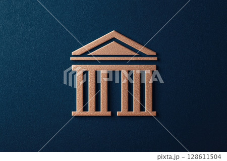 A gold colored building with columns 128611504