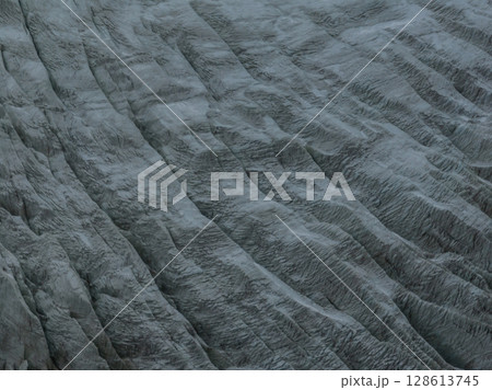 Aerial view of beautiful hanging glacier in high altitude mountains landscape 128613745