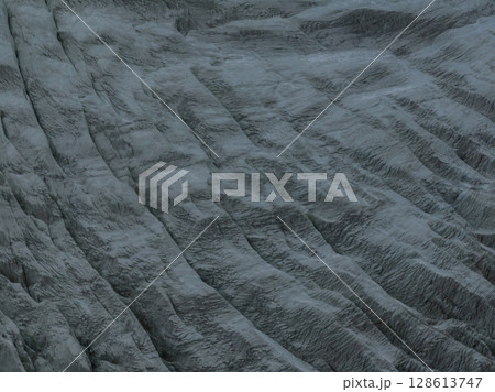 Aerial view of beautiful hanging glacier in high altitude mountains landscape 128613747