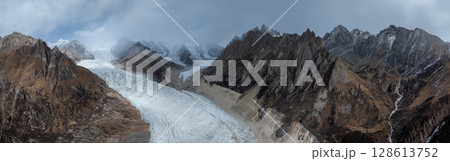 Aerial view of beautiful hanging glacier in high altitude mountains landscape 128613752