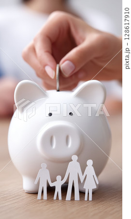 Family saving money by putting coin into white piggy bank, symbolizing budget planning and financial security for future 128617910