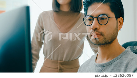 Closeup group Adult Asia male, female freelance meeting write prompt AI bot IT app smart program nomad, video game, talk strategy, discuss plan, user interface, designer, data center desktop computer. 128620087