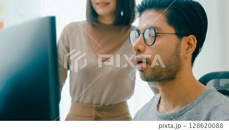 Closeup group Adult Asia male, female freelance meeting write prompt AI bot IT app smart program nomad, video game, talk strategy, discuss plan, user interface, designer, data center desktop computer. 128620088