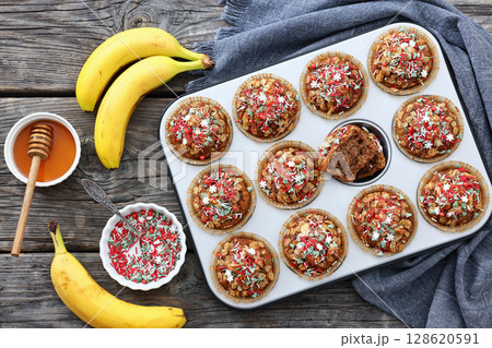 banana bread oat muffins with christmas sprinkles 128620591
