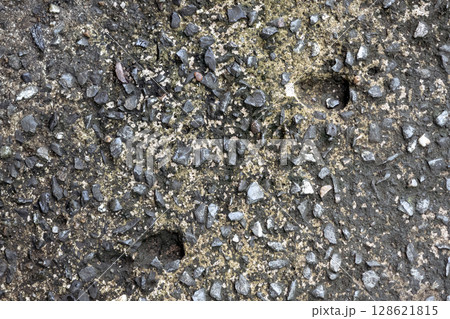 Dark cement floor with small stone for texture or background Dark cement floor with small stone for texture or background 128621815