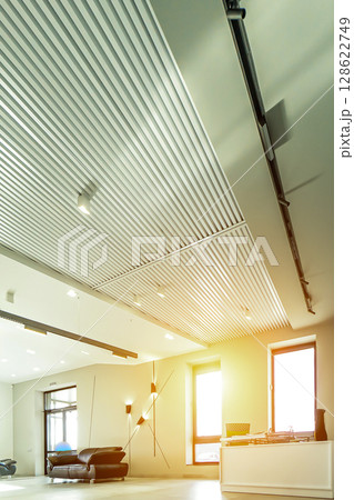 Modern white office with open space and large windows sun sunny light Modern white office with open space and large windows sun sunny light 128622749