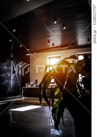 Office room with blank computer display,table,chair,cement floor,glass walls with night city view. Mixed media . 128622797