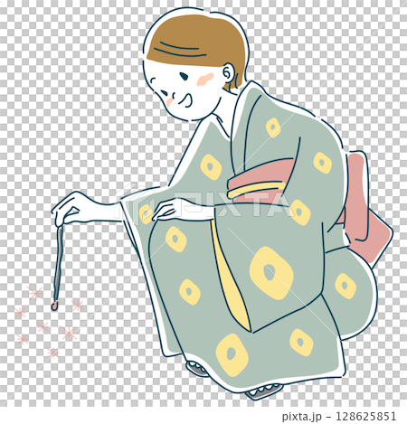 A woman in a yukata playing a sparkler 128625851