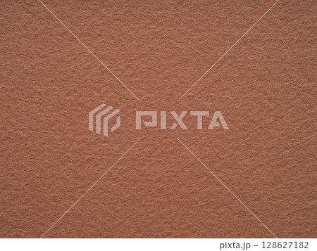 A serene expanse of terracotta felt, its earth-toned whispers hinting at ancient clay and timeless artistry. A serene expanse of terracotta felt, its earth-toned whispers hinting at ancient clay and timeless artistry. 128627182
