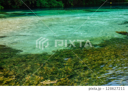 Turquoise and green water of river of Blue Eye Nature Monument near to Saranda, Albania Turquoise and green water of river of Blue Eye Nature Monument near to Saranda, Albania 128627211