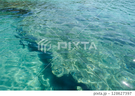 beautiful turquoise crystal clear water in shallow sea with coral reef beautiful turquoise crystal clear water in shallow sea with coral reef 128627397