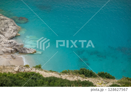 private and secluded paradise beach on the Albanian coast, aerial view private and secluded paradise beach on the Albanian coast, aerial view 128627567