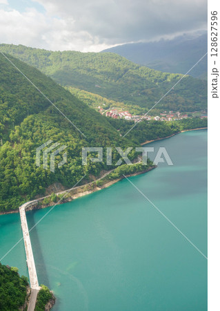 Piva lake and the city of Pluzine on background. Montenegro, Europe 128627596