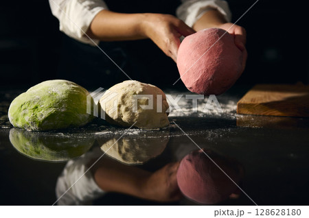 Artisan Preparing Colorful Italian Dough for Pasta in a Traditional Kitchen 128628180