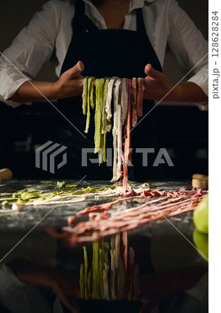 Chef Crafting Vibrant Tricolor Pasta Highlighting Italian Culinary Traditions 128628284