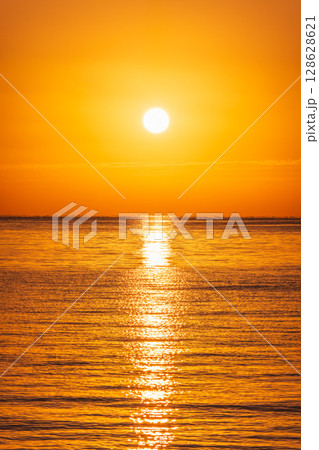 Beautiful red and orange sunrise over the sea. 128628621