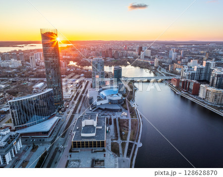 Yekaterinburg aerial panoramic view in spring at sunset. Yekaterinburg city and pond in spring or autumn. Yekaterinburg aerial panoramic view in spring at sunset. Yekaterinburg city and pond in spring or autumn. 128628870
