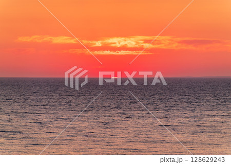 Beautiful red and orange sunrise over the sea. 128629243