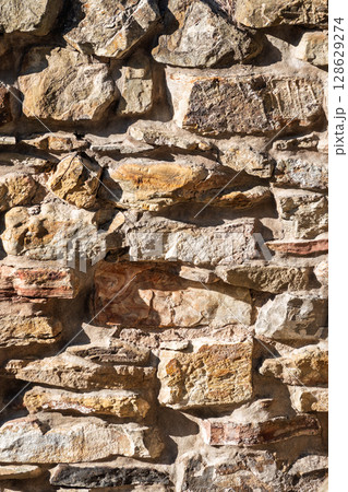 Backgrounds of the old stone wall. 128629274