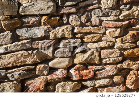 Backgrounds of the old stone wall. 128629277
