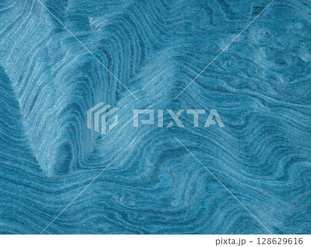 A tranquil sea of jade washes over this unique poplar burl veneer, with waves of verdant tones swirling in harmony 128629616