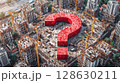 Urban Development Question: A large red question mark dominates a city's skyline, questioning the future of construction and growth. 128630211