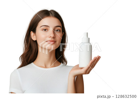 Close up of a neutral hand holding a matte finish glass skincare bottle against a clean white background The product packaging is simple and modern showcasing a minimalist design for a natural 128632500