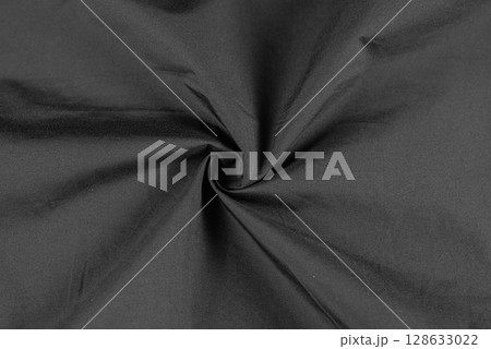 Photo of black fabric on black. Crumpled black fabric. Isolated photo of fabric. 128633022