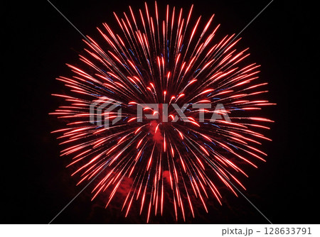Red and Blue Fireworks Explosion at Night 128633791