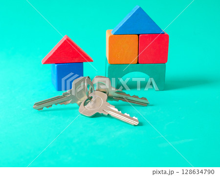 Toy red house with key, concept finance growth and property . Toy red house with key, concept finance growth and property . 128634790