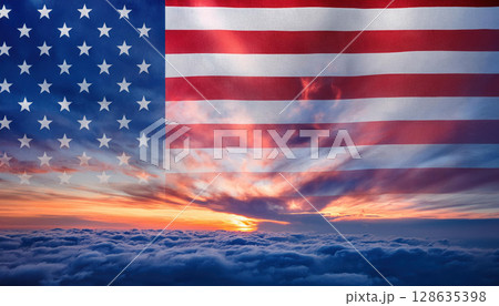 cloudy sky with beautiful sunset and ethereal USA flag blended into horizon 128635398