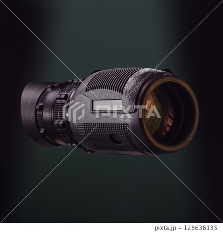 Black monocular on green photo. Beautiful photo of a monocular. Optics for hunters and tourists. Optics for observation. Black monocular on green photo. Beautiful photo of a monocular. Optics for hunters and tourists. Optics for observation. 128636135