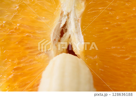 Detailed close-up photo of a fresh halved orange and banana. Symbol of male and female. Detailed close-up photo of a fresh halved orange and banana. Symbol of male and female. 128636188