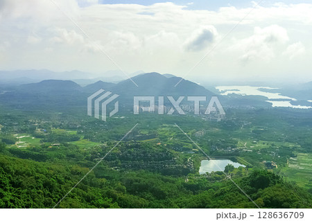 View of the beautiful jungle depths of Yanoda Park on Hainan Island, China. View of the beautiful jungle depths of Yanoda Park on Hainan Island, China. 128636709